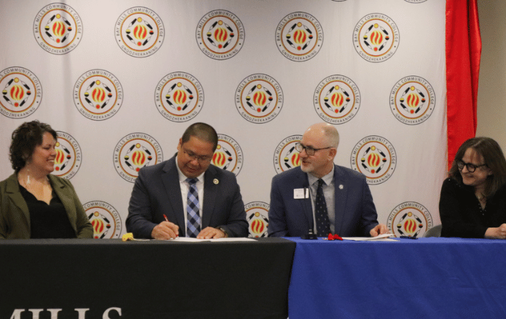 BMCC President Dr Duane Bedell and LSSU President Dr David Travis sign the articulation agreement for Early Childhood Education